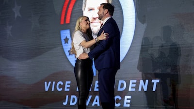 Erika Kirk, widow of Turning Point USA founder Charlie Kirk, and U.S. Vice President JD Vance embrace during a Turning Point USA event at the Pavilion at Ole Miss at the University of Mississippi in Oxford, Mississippi, U.S. October 29, 2025. REUTERS/Jonathan Ernst/Pool