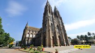 <strong>St. Philomena’s Church, Mysore:</strong> The twin-towered beauty of Mysore shines at Christmas with glowing stained glass, soulful choir music, peaceful prayers, and a festive crowd that fills the church with warmth and devotion.