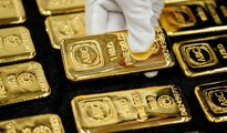 Gold steadies as traders book profits after rally to record
