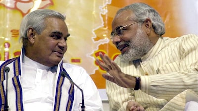 This 2002 photo features then Prime Minister Atal Behari Vajpayee (L) and then BJP Gujarat state chief ministerial candidate Narendra Modi at an election campaign rally in Ahmedabad. 9Image credit: AFP)