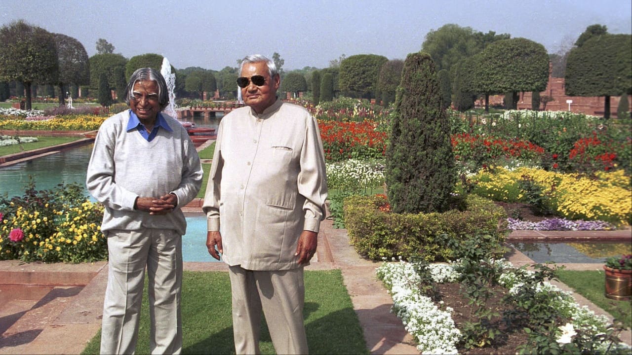 Former President APJ Abdul Kalam and former Prime Minister Atal Behari Vajpayee pose for a photo at a breakfast meeting 16 March 2003 on the lawns of the Mughal Gardens at the Presidential Palace in New Delhi. (Image credit: AFP)