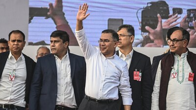 Tarique Rahman waves to supporters after his arrival in Dhaka on December 25, 2025. (AFP)