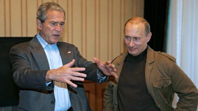 (FILES) U.S. President George W. Bush gestures as he speaks with his Russian counterpart Vladimir Putin (R) at Bocharov Ruchei in Sochi April 5, 2008.  REUTERS/RIA Novosti/Kremlin 
