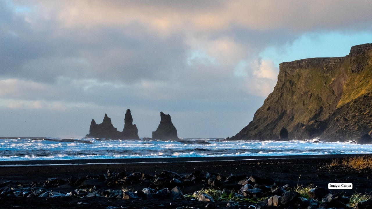 8. Reynisfjara Beach – Iceland Dark basalt sand, towering sea stacks and hexagonal rock columns give Reynisfjara an almost apocalyptic beauty. With powerful Atlantic waves crashing ashore, it feels like standing at the edge of the world.