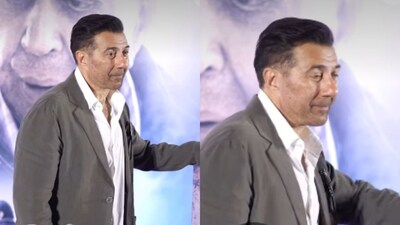 In one of the widely shared clips, Sunny Deol is seen pausing for the paparazzi while standing next to Dharmendra’s poster.