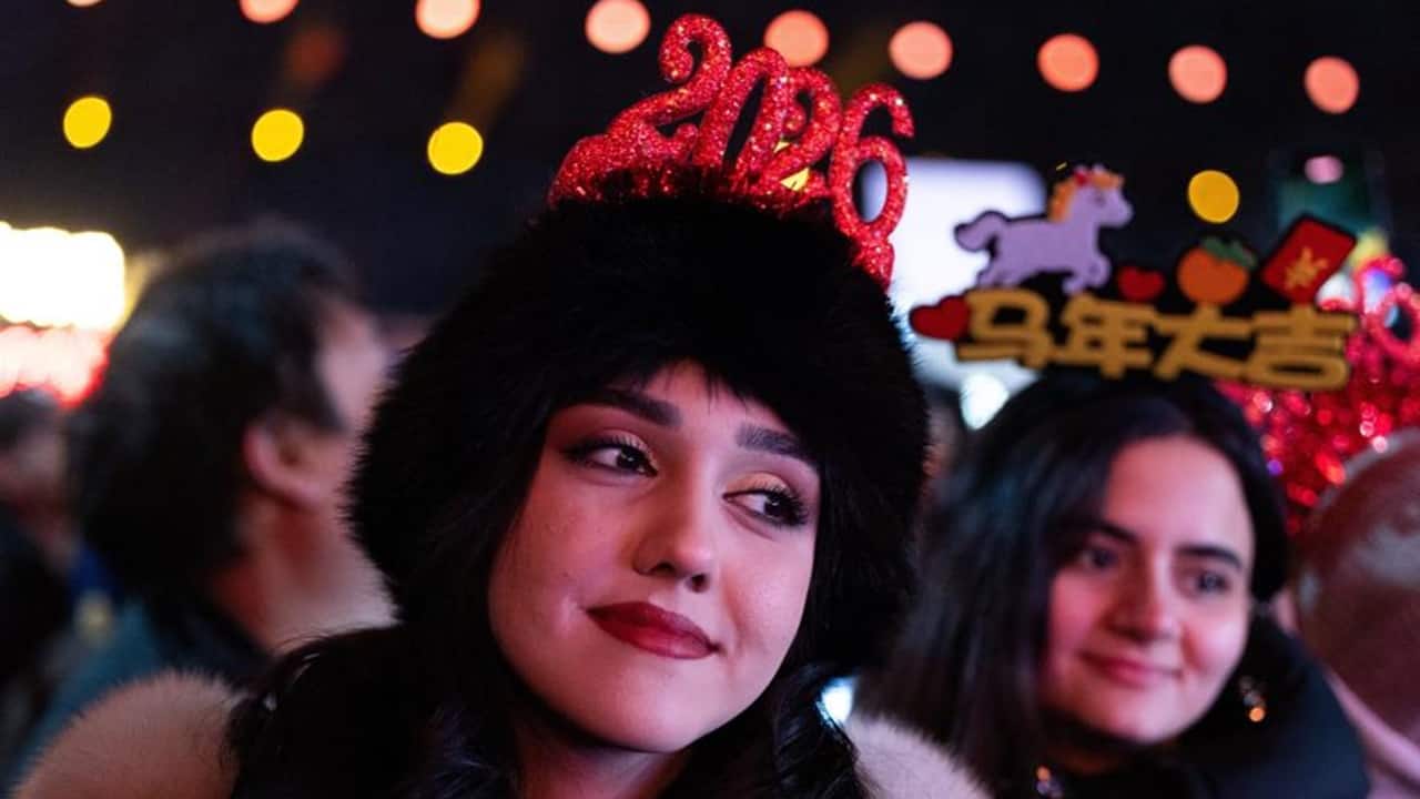 A woman looks on during a New Year countdown ceremony at the Juyongguan section of the Great Wall, also known as Juyong Pass, in Beijing, China, December 31, 2025. REUTERS/Maxim Shemetov