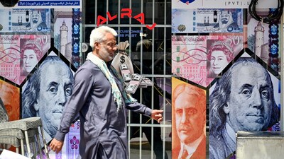 A man walks past a currency exchange shop in Rawalpindi on June 12, 2024. (Photo by Farooq NAEEM / AFP)