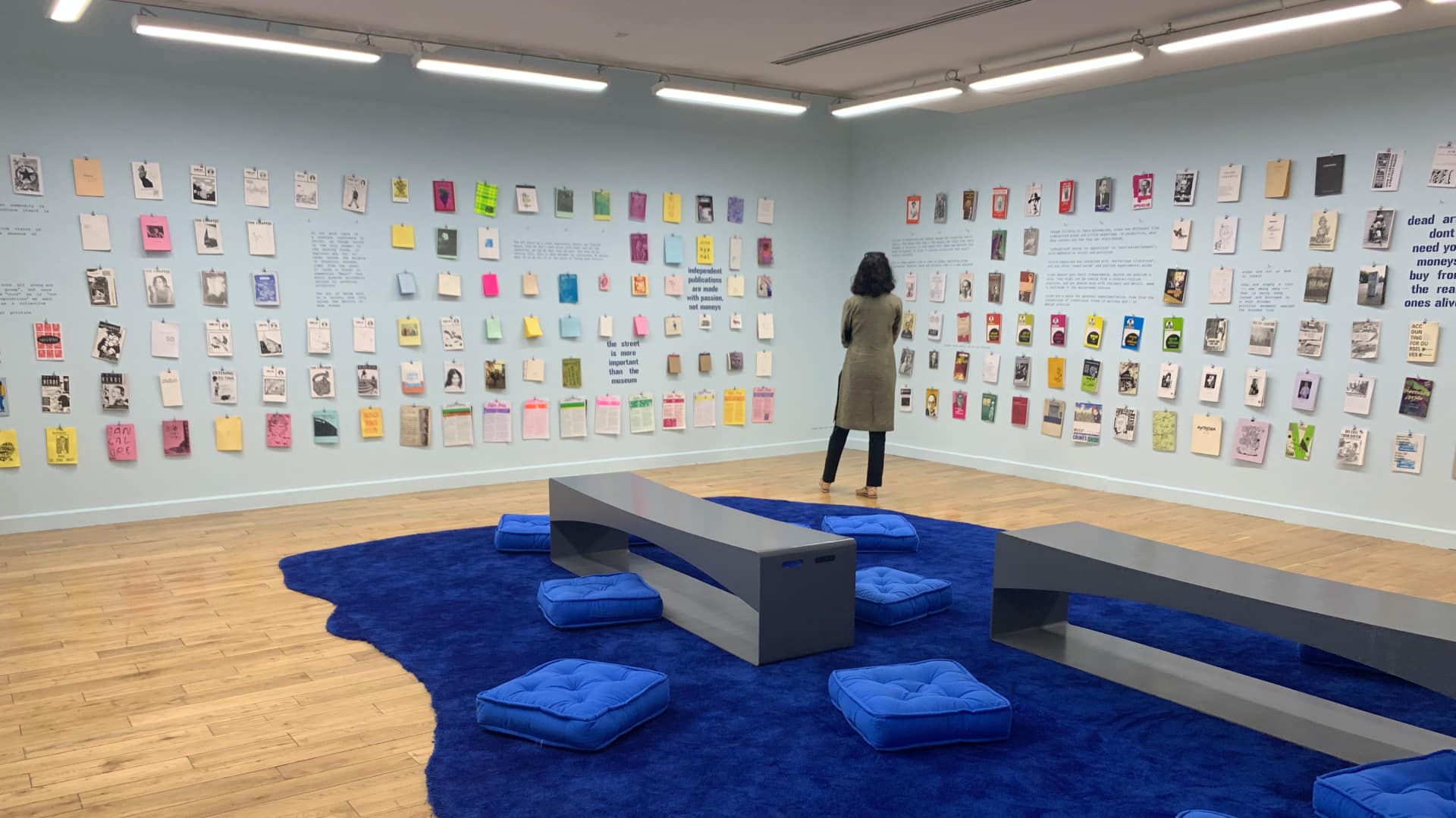 Zines are strung up with paperclips inside 'The Blue Room' of 'please touch gently'.  Visitors are encouraged to take down the ones they want to read, and then return them to the same spot after reading.