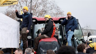 French farmers protesting with tractors in Paris (Image: Reuters)