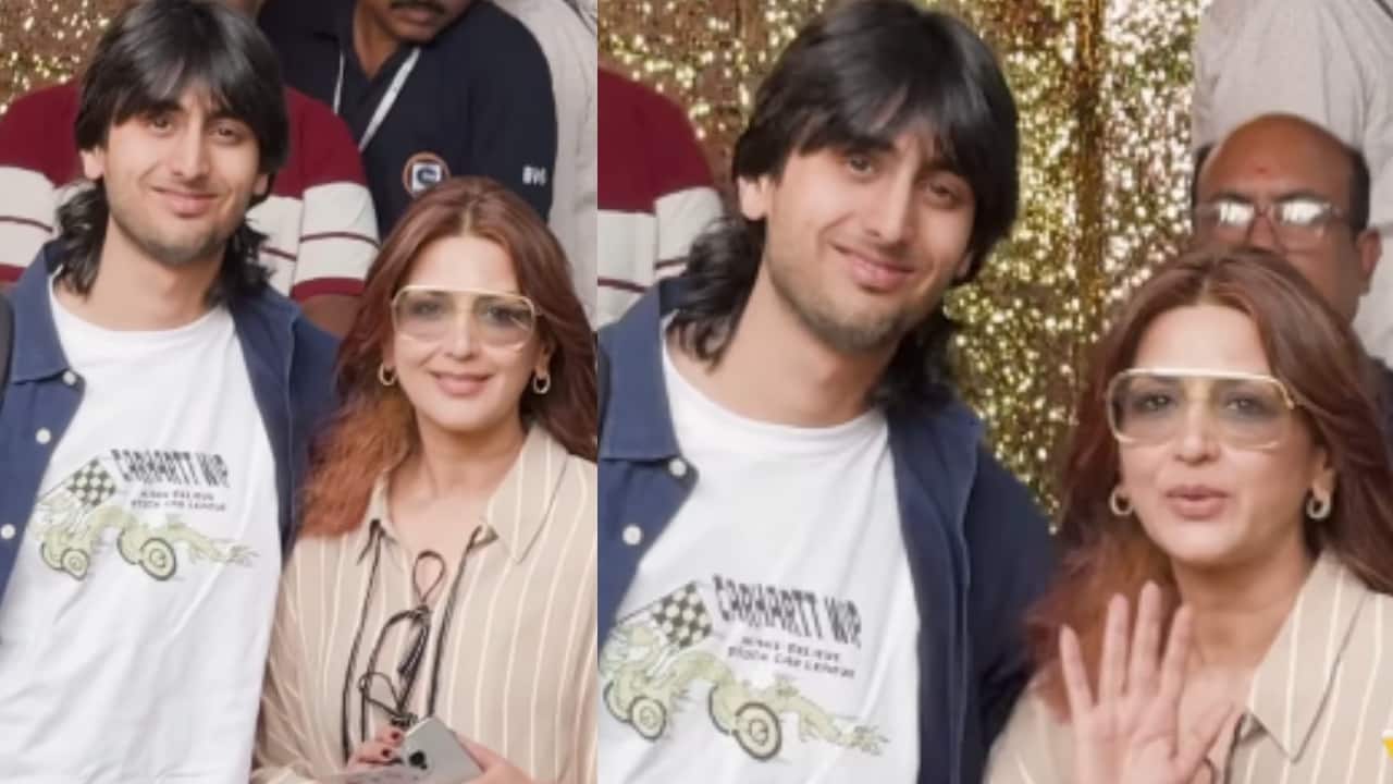 Sonali Bendre poses for paps with her son Ranveer Behl at the Mumbai airport