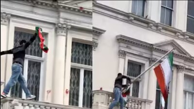 Protester scales Iranian embassy in London, tears down regime flag in viral video