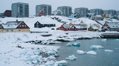 Apartment buildings and houses are pictured in Nuuk, Greenland, on March 24, 2025. Greenland's Prime Minister Mute Egede accused Washington of interfering in its political affairs with the visit of an American delegation to the Danish territory coveted by US President Donald Trump. The White House announced on March 23, 2025 that Usha Vance, the wife of US Vice President JD Vance, will visit Greenland with her son and a US delegation, which Egede said would include National Security Adviser Mike Waltz. (Photo by Juliette PAVY / AFP)
