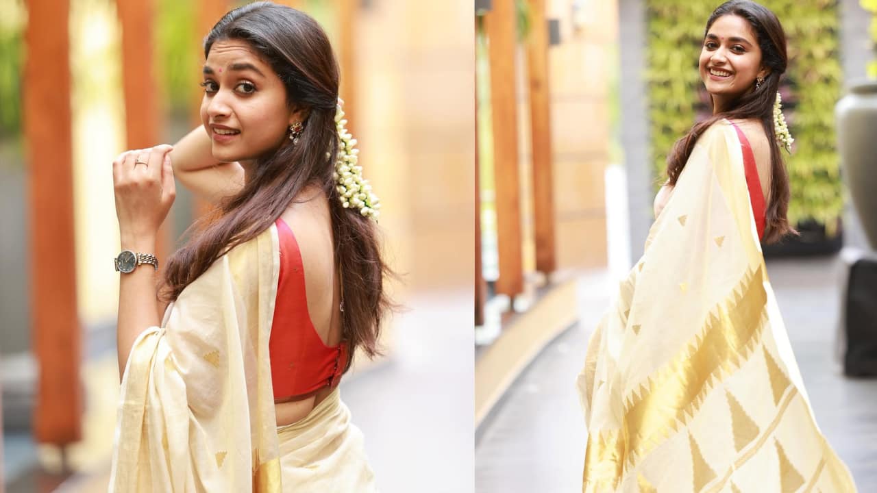 Kasavu with Red Twist Keerthy combines Tamil Nadu history with a modern edge by wearing a beige-gold Kasavu saree with a crimson red sleeveless top. To embody true Pongal grace, choose off-white Kasavu with contrasting blouses and oxidised temple jewellery.
