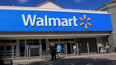 A Walmart sign hangs on the exterior of the store on November 20, 2025 in Hollywood, Florida. 
