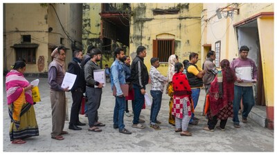 People gather at a school during a hearing under the Special Intensive Revision (SIR) of electoral rolls, in Kolkata, West Bengal. (Courtesy: PTI photo)