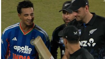 New Zealand players check Abhishek Sharma’s bat after Guwahati assault. (Photo: JioHotstar)