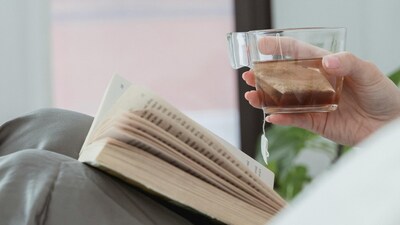 How to unwind: The best way to rest after a long day at work is by going for a digital sunset of 60–90 minutes before bed and switch to low-stimulation activities, like reading a book (Image: Pexels)