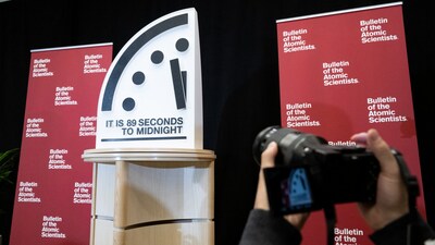 The Doomsday Clock is seen at 89 seconds to midnight, the closest the clock has ever been to midnight in its 78-year history to signal that the world is on a course of unprecedented risk, as set by the Bulletin of the Atomic Scientists Science and Security Board, at the US Institute of Peace in Washington, DC, January 28, 2025. (Photo by SAUL LOEB / AFP)