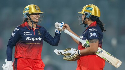 Royal Challengers Bengaluru's captain Smriti Mandhana and teammate Richa Ghosh celebrate their victory during a Women's Premier League (WPL) 2026 T20 International cricket match between Royal Challengers Bengaluru and UP Warriorz, at BCA Stadium, in Vadodara, Gujarat. (BCCI via PTI Photo)