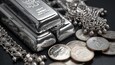 Silver extends plunge, wiping out gains in very volatile market