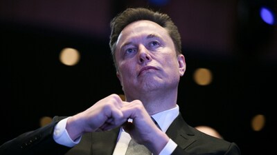 (FILES) Elon Musk looks on as US President Donald Trump speaks at the US-Saudi Investment Forum at the John F. Kennedy Center for the Performing Arts in Washington, DC on November 19, 2025. (Photo by Brendan SMIALOWSKI / AFP)