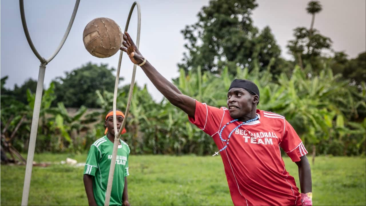 Trave Katumba, 18, who plays as a chaser, jumps on the air to score during a training session of Quidditch, also known as Quadball. (Image credit: AFP)