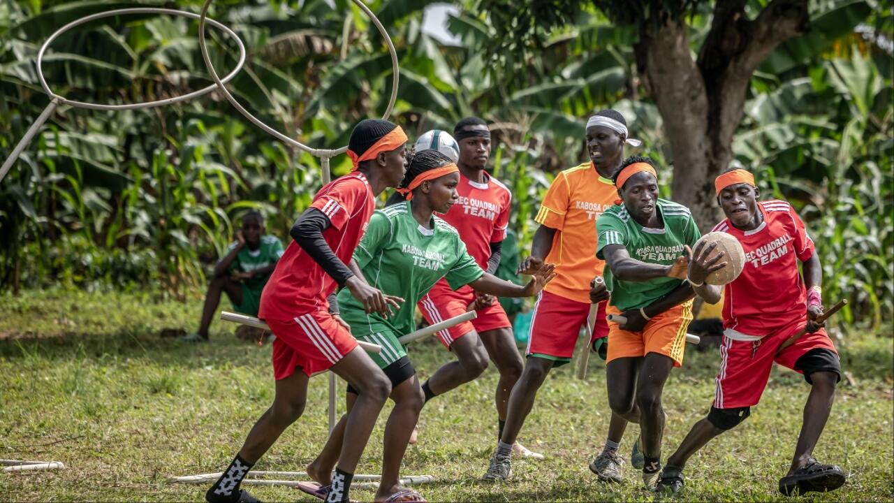 Chasers and beaters with sticks between their legs fight for the ball during a game of Quidditch, also known as Quadball. (Image credit: AFP)