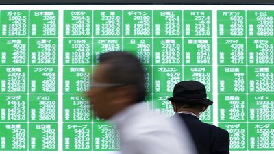 An electronic stock board outside a securities firm in Tokyo, Japan, on Monday, Sept. 30, 2024. Japanese stocks tumbled after Shigeru Ishiba's surprise victory over Sanae Takaichi in the ruling party's leadership race wrongfooted investors who had bet on a boost from more monetary stimulus from his rival. Photographer: Kiyoshi Ota/Bloomberg
