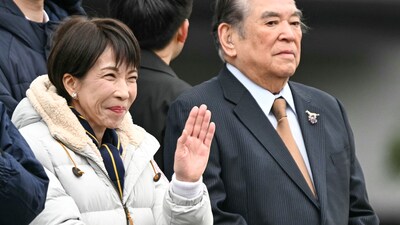 Japan's Prime Minister and President of the Liberal Democratic Party (LDP) Sanae Takaichi (L) waves to the people upon her arrival to deliver a campaign speech ahead of the House of Representatives election, at Rekisen Park in Tokyo on February 7, 2026. (Photo by Philip FONG / AFP)