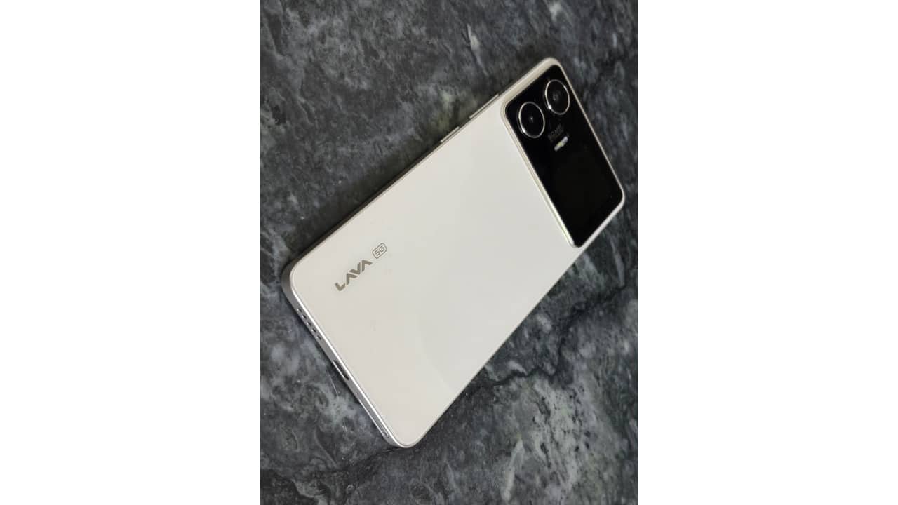 Design that looks bold but feels sharp The raised rear plateau helps the phone stand out and prevents wobbling, but flat edges and glossy surfaces reduce in-hand comfort. Sharp edges can dig into the palm, making the included case almost essential for daily use.