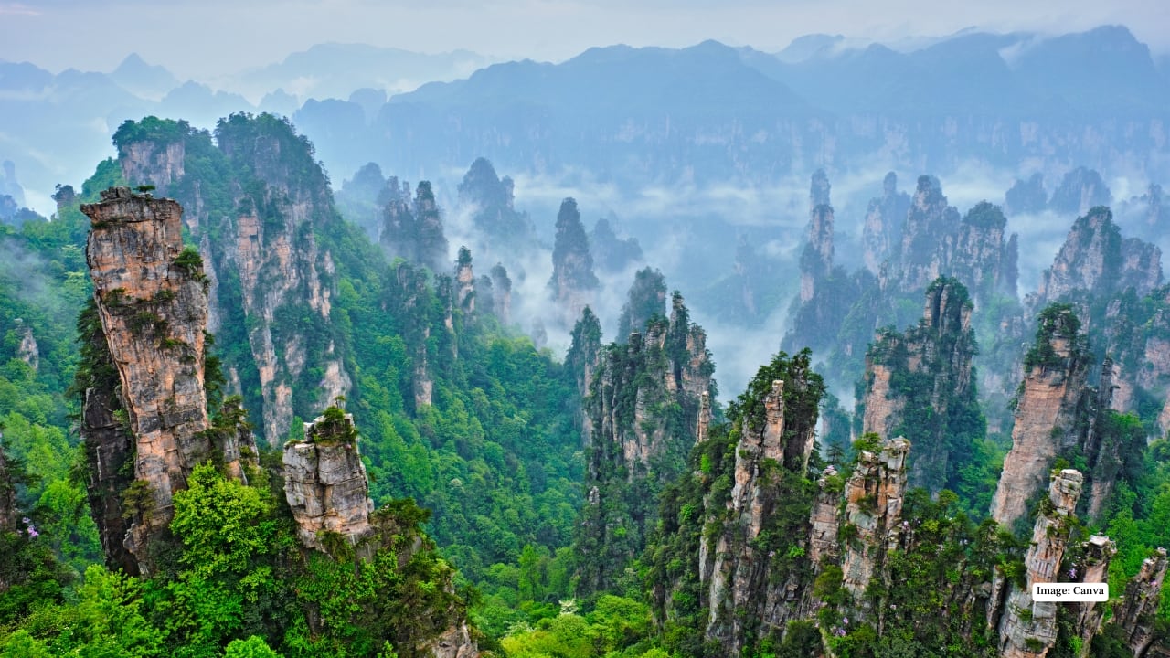 6. Zhangjiajie National Forest Park In Hunan province, towering sandstone pillars soar dramatically into the clouds, creating one of China’s most surreal natural settings. Zhangjiajie’s vertical rock formations, deep ravines and forested valleys gained global attention for inspiring scenes in the film Avatar. Glass skywalks and panoramic cable car rides add a sense of scale to the already jaw-dropping terrain.