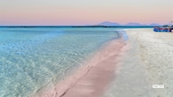 <strong>2. Elafonissi Beach, Crete, Greece</strong><br />Famed for its blush-toned shoreline, Elafonissi Beach in Crete stands out for its pink-tinged sands and shallow turquoise lagoons. The beach’s gentle waters make it family-friendly, while deeper sections attract swimmers and snorkellers. Many travellers recommend staying through sunset, when the colours intensify and the crowds begin to thin.
