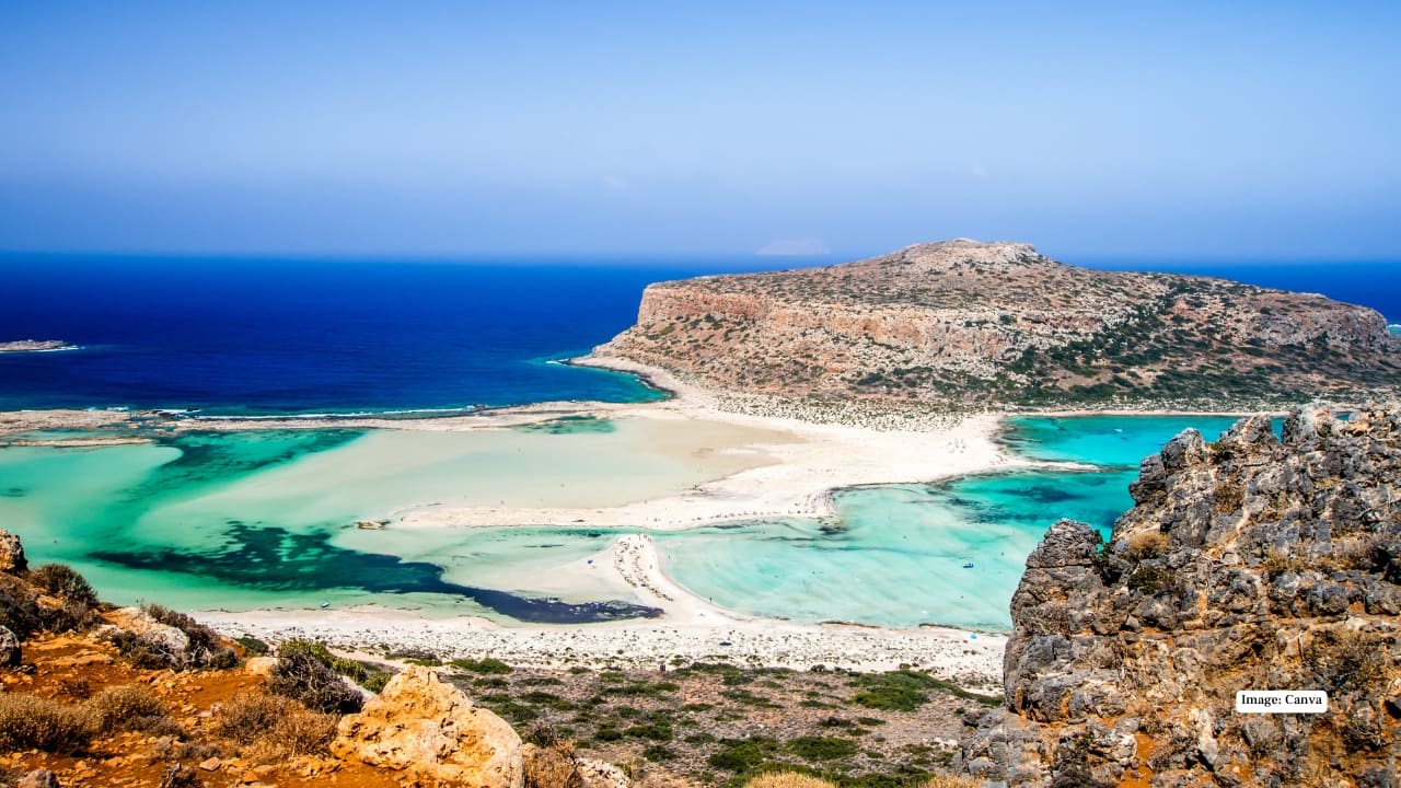 <strong>3. Balos Lagoon, Crete, Greece</strong><br />Also in Crete, Balos Lagoon offers a quieter alternative with crystal-clear waters and pale sandbanks. Its shallow, calm waters make it especially popular with families. Despite its semi-secluded feel, the beach remains accessible and is supported by basic amenities, including snack and drink options nearby.