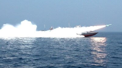 This handout photo released by Iran's Revolutionary Guards Corps (IRGC)'s official website Sepanews on February 17, 2026, shows a rocket being fired from a boat during a military exercise by members of the IRGC and navy in the Strait of Hormuz. (Photo by SEPAH NEWS / AFP)