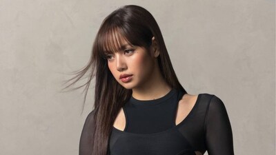 Lisa shares pic in sheer black dress