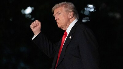 (FILES) US President Donald Trump gestures as he walks on the South Lawn upon arrival at the White House in Washington, DC, on November 2, 2025. (Photo by Allison ROBBERT / AFP)