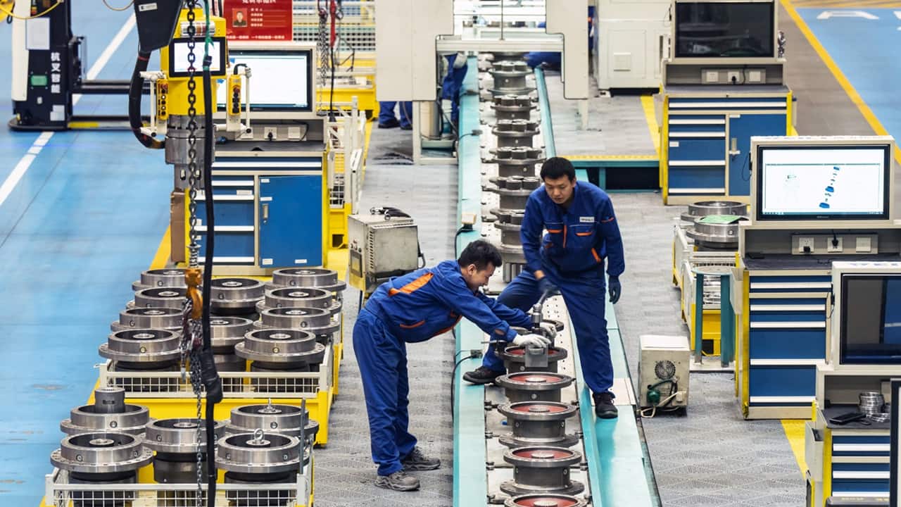 Workers on the production line at a transmission technology factory in Yinchuan, Ningxia autonomous region, China. Photographer: Qilai Shen/Bloomberg