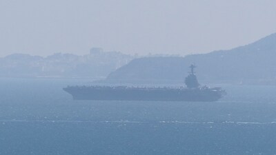 USS Gerald R. Ford aircraft carrier in the sea waters as seen from Gibraltar, with Northern Africa in the background, February 20, 2026, in this screen grab obtained from a social media video. 