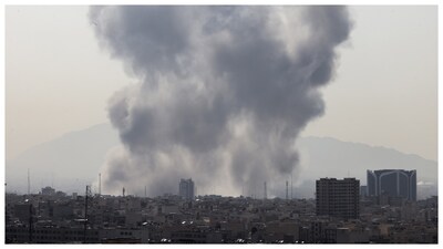 A plume of smoke rises following an explosion in Tehran. (Courtesy: AFP photo)