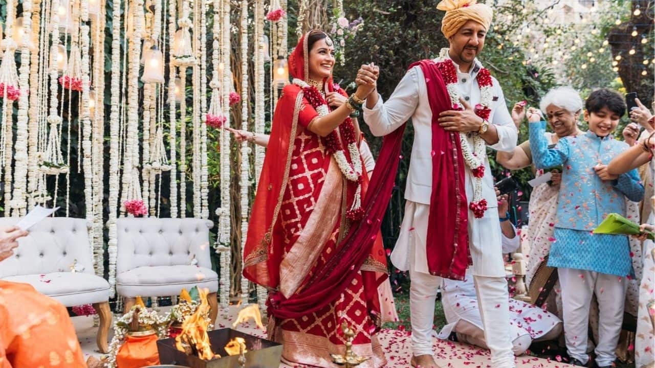 Dia Mirza Dia Mirza opted for a red Banarasi saree by Raw Mango for her wedding to Vaibhav Rekhi. The handwoven saree featured subtle gold motifs and a timeless silhouette. Her look was understated yet powerful, reflecting sustainability and grace.