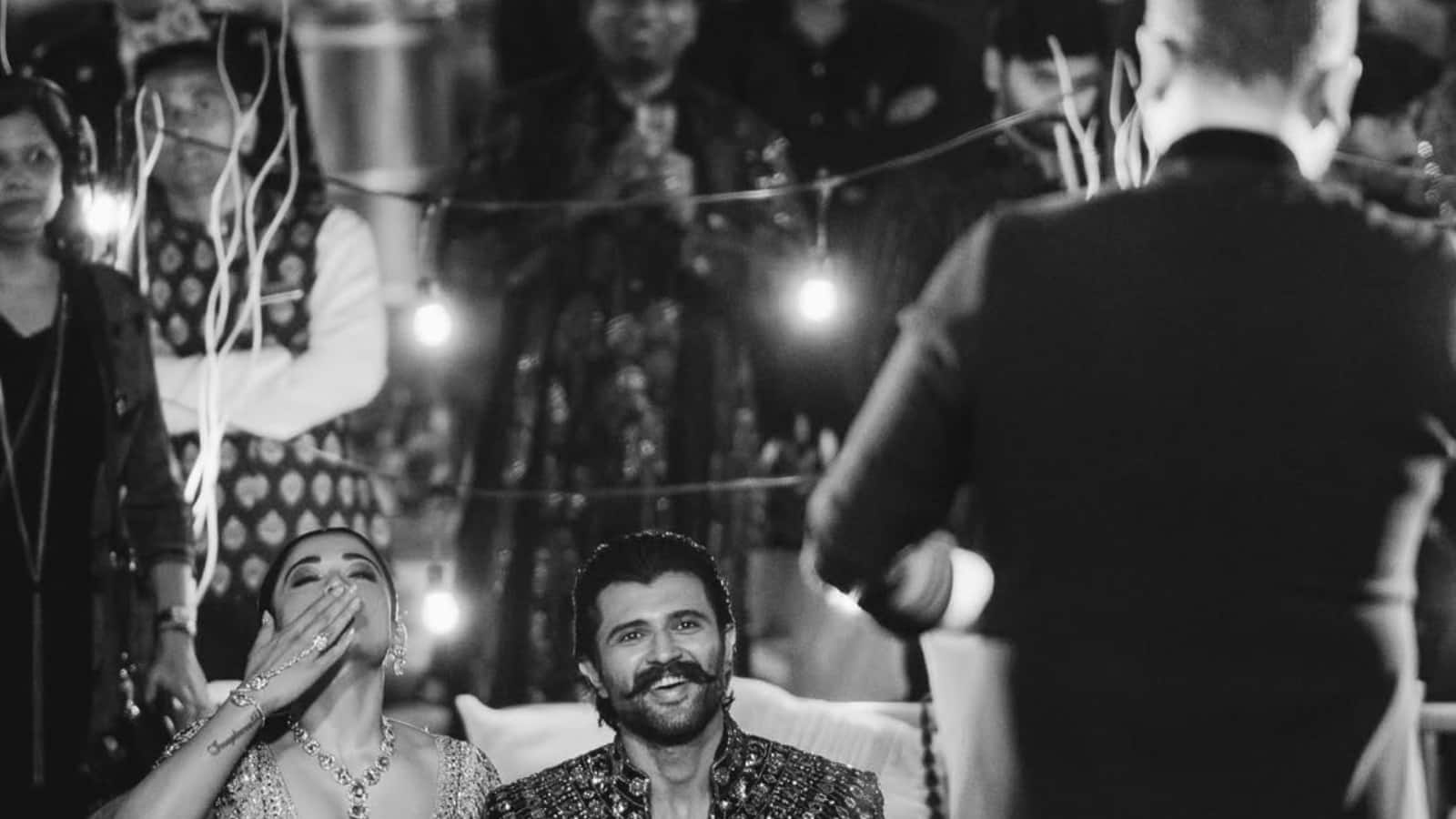 Rashmika is ecstatic as father makes emotional speech  One of the most touching visuals is of both families standing together as speeches are being made. Rashmika looks teary-eyed. 