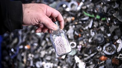 This photograph taken on June 22, 2021 shows a vial filled with rare earths (terres rares) after they were extracted from electronic waste at the Bureau de Recherches Geologiques et Minieres (BRGM) (Geological and Mining Research Office) in Orleans, central France. (Photo by Christophe ARCHAMBAULT / AFP)