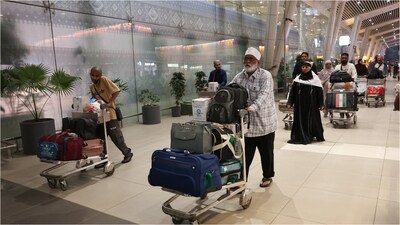 Pilgrims who were stranded in Jeddah amid the US-Israel war with Iran, arrive at the Sardar Vallabhbhai Patel International Airport in Ahmedabad, on March 4, 2026. (Reuters Photo)