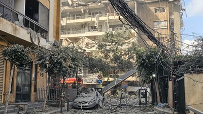 Debris litters a street following an Israeli airstrike that targeted the Haret Hreik neighbourhood in Beirut’s southern suburbs on March 4, 2026. Israel launched fresh strikes on Iran and Lebanon, where state media reported a residential building was hit on March 4, as Iran's Guards said they had sealed off one of the world's most vital shipping routes for energy. (AFP)