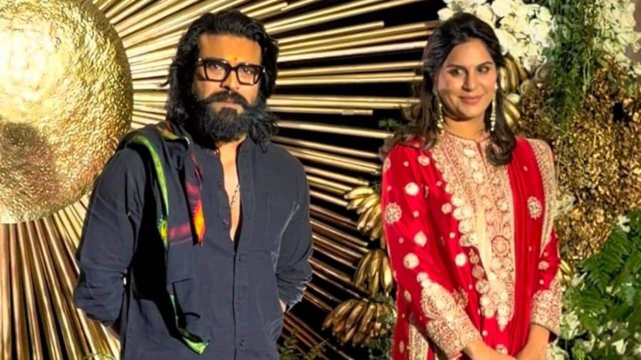 Ram Charan and Upasana <br /> Ram Charan arrived at the reception with his wife Upasana Kamineni, adding warmth and elegance to the celebration. Ram Charan chose a dark, understated ensemble that reflected effortless sophistication, while Upasana stood out in a vibrant red traditional outfit adorned with intricate embroidery. The couple greeted Rashmika and Vijay with heartfelt warmth and happily posed for the photographers, contributing to the evening’s celebratory spirit.