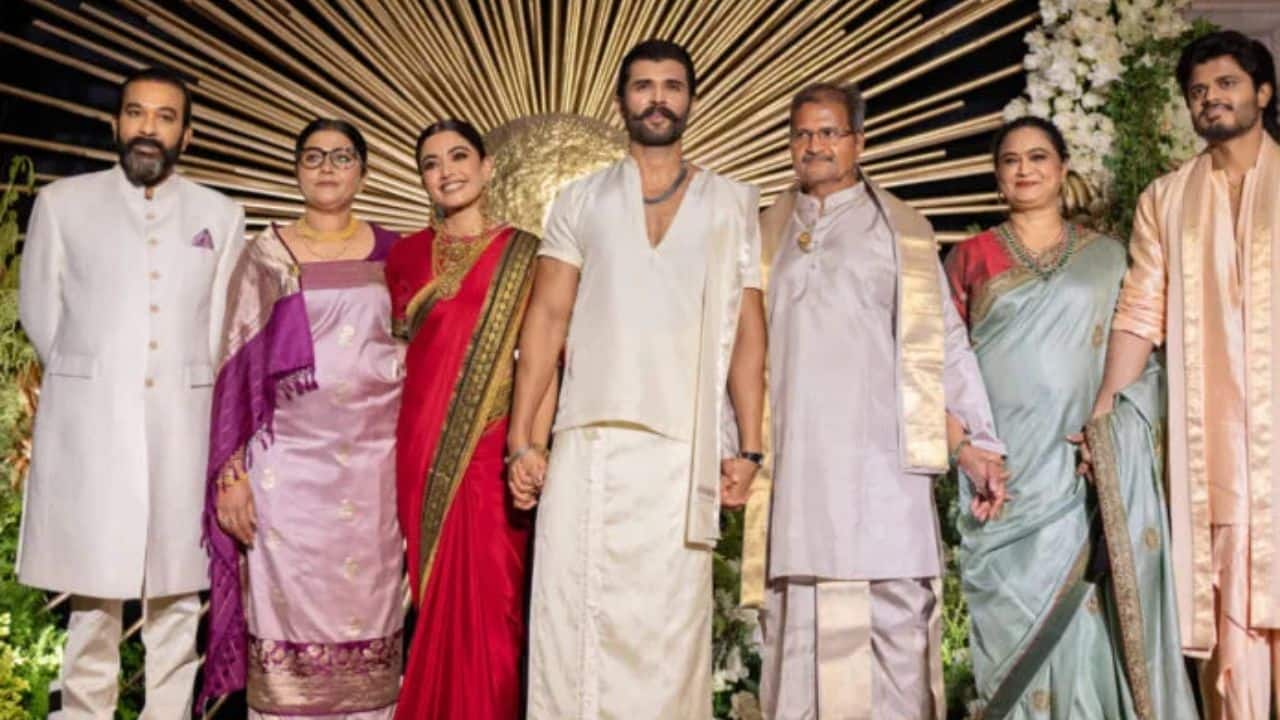 Rashmika and Vijay with Their Families One of the most heartwarming moments from the evening was a picture-perfect frame featuring the newlywed couple alongside their respective families. Radiating happiness and elegance, Rashmika and Vijay posed proudly with their loved ones, marking the beginning of a new chapter surrounded by warmth and blessings.