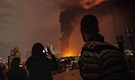 Iran warns of acidic rain in Tehran after oil depot fires