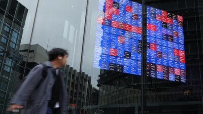 A screen displays share prices inside the Kabuto One building in Tokyo, Japan, on Monday, March 2, 2026. Japanese shares dropped in early Tokyo trading after US-Israeli strikes on Iran hit risk appetite and pushed oil prices higher. Photographer: Kiyoshi Ota/Bloomberg