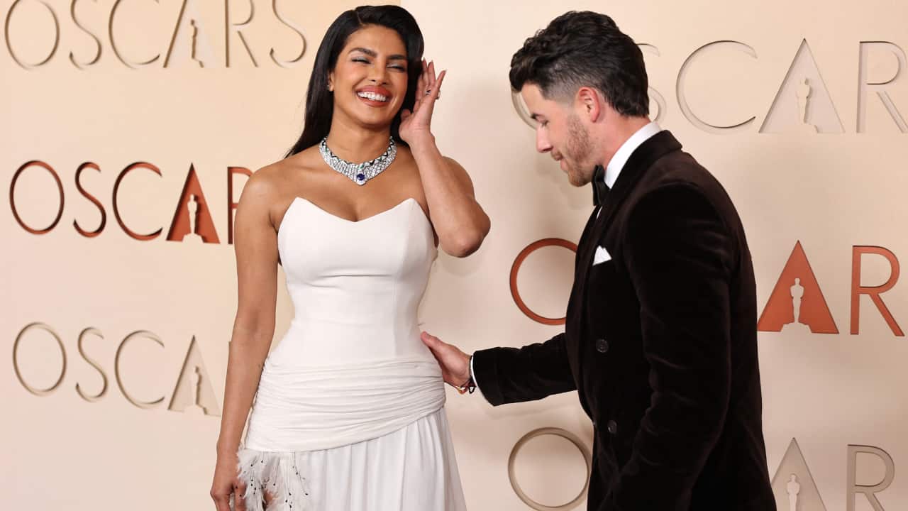 Priyanka paired the ensemble with pointed black heels and a dazzling diamond necklace.  Nick Jonas Jonas complemented her in a classic black velvet tuxedo with a crisp white shirt and bow tie. 