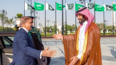 (FILES) Saudi Arabia's Crown Prince Mohammed bin Salman (R) welcoming Pakistan's Prime Minister Shehbaz Sharif ahead of their meeting in Riyadh on September 17, 2025. (AFP)